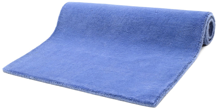 Placid Blue area rug rolled view