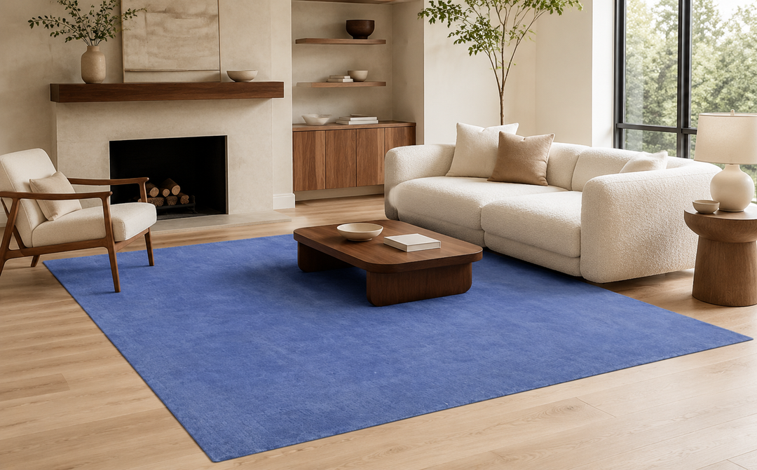Placid Blue wool area rug staged in a modern neutral living room